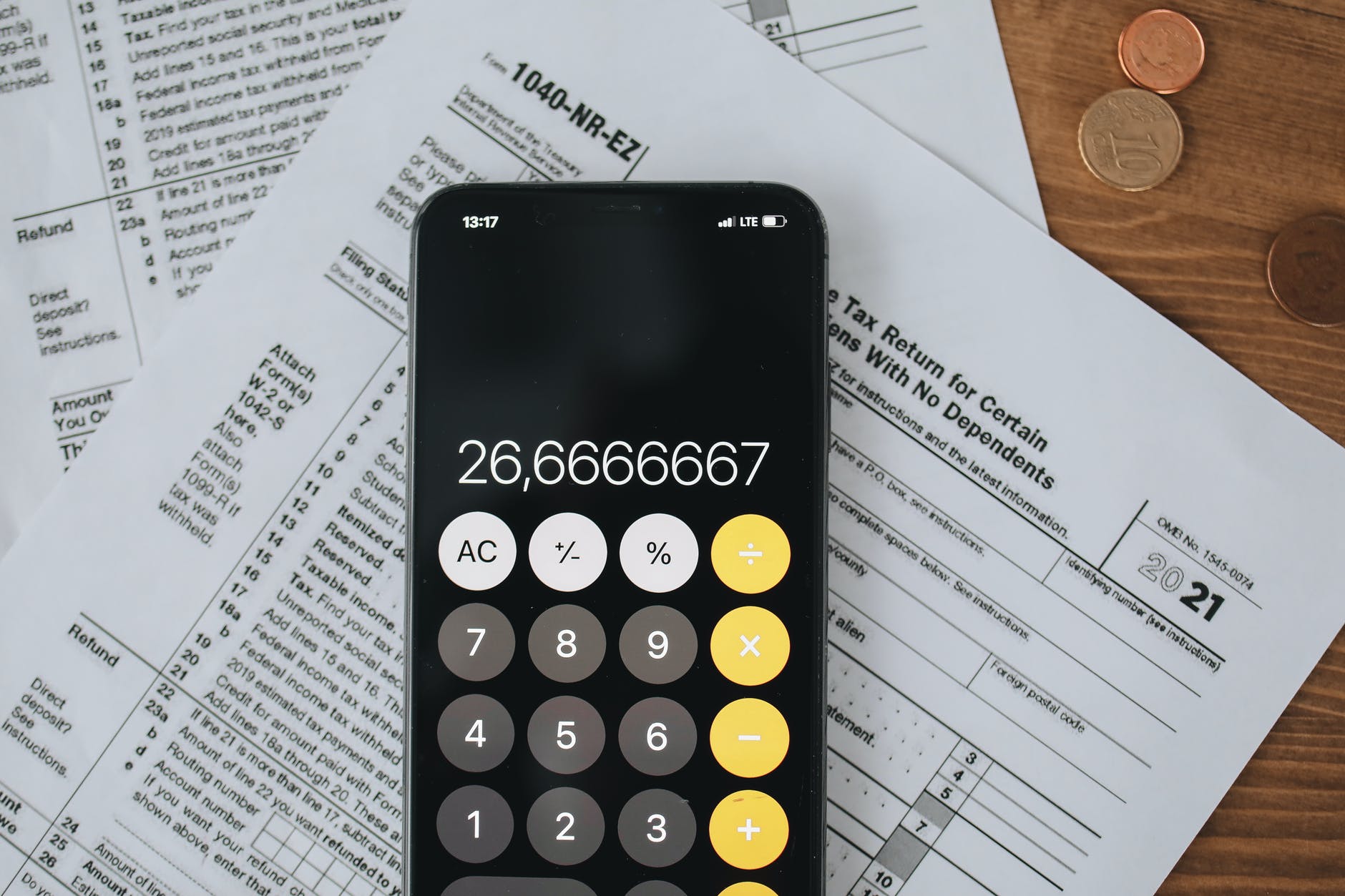 Must-Have Accounting Software for Your Business 2 tax forms and calculator in close up view